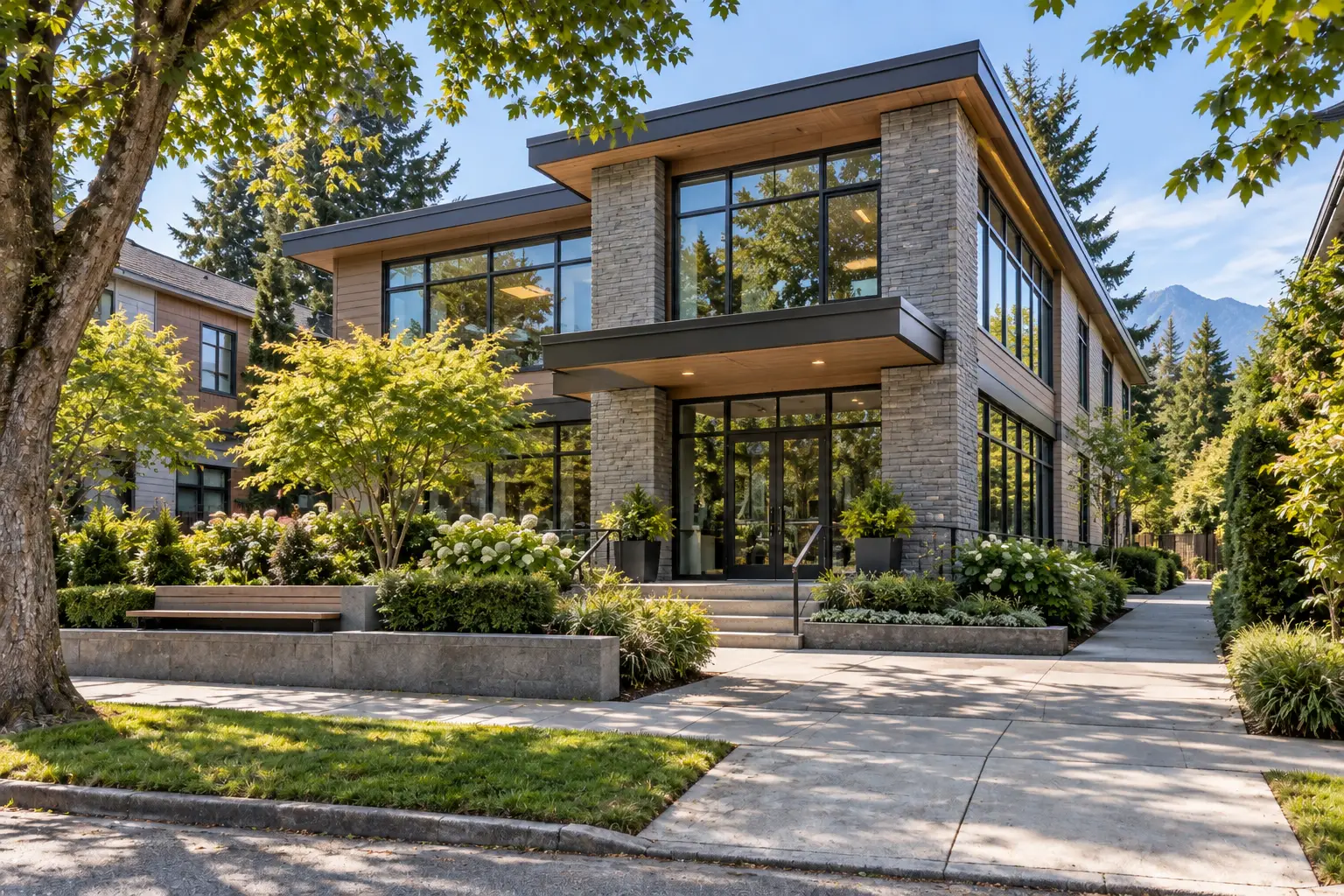 Modern low-rise Vancouver commercial property with landscaped entry and concrete hardscape